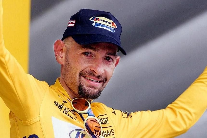 Marco Pantani on the podium of the 20th stage of the Tour de France in Le Creusot, central France on Aug 1, 1998.&nbsp;Public prosecutors in Italy have reopened the case into the death of former cycling champion Marco Pantani after new evidence emerg