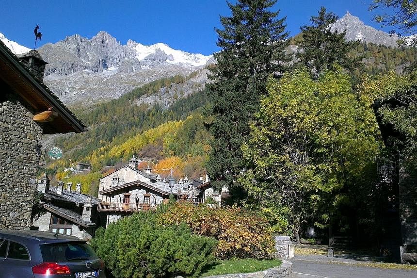 The bodies of two Belgian climbers who were swept away by falling rocks and ice on France's Mont Blanc mountain (background) were found on Saturday, Aug 2, 2014, after two days of searching, police rescue officials said. -- PHOTO: BUSINESS TIMES FILE