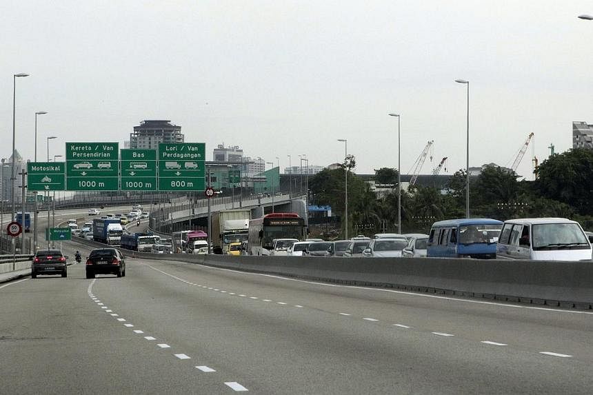 Motorists will soon have to pay higher toll rates on the Singapore side of the Causeway, after the Land Transport Authority (LTA) said yesterday that it will match Malaysia's new levies in the next few weeks. -- ST PHOTO:&nbsp;NEO XIAOBIN