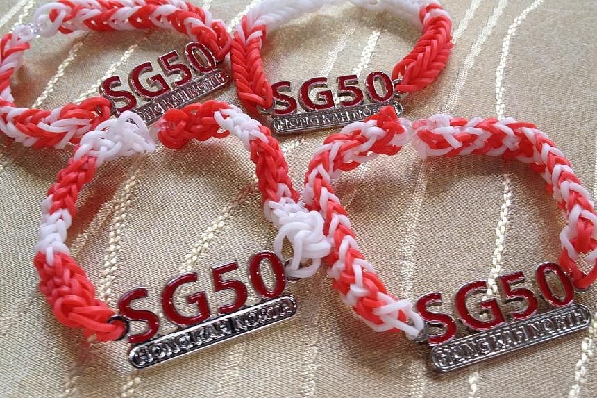 Special Hong Kah North SG50 friendship bands will be made and sold by residents for $2 each to raise funds for a new Pioneer Generation Fund for the constituency's elderly residents.&nbsp;-- ST PHOTO: JOANNA SEOW&nbsp;