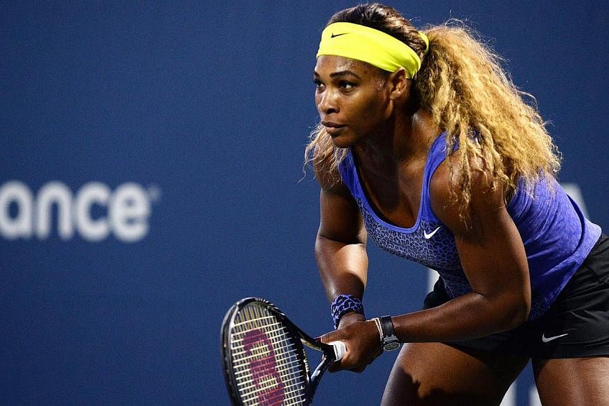 Serena Williams of the United States of America plays against Ana Ivanovic of Serbia during Day 5 of the Bank of the West Classic at the Taube Family Tennis Stadium on Aug 1, 2014 in Stanford, California. -- PHOTO: AFP