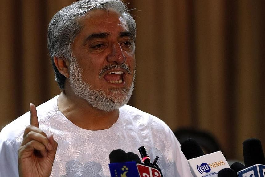 Afghan presidential candidate Abdullah Abdullah speaks during a news conference in Kabul, July 6, 2014.&nbsp;Afghan presidential candidate Abdullah Abdullah has agreed to rejoin an audit of the votes, United Nations officials said on Sunday, after te