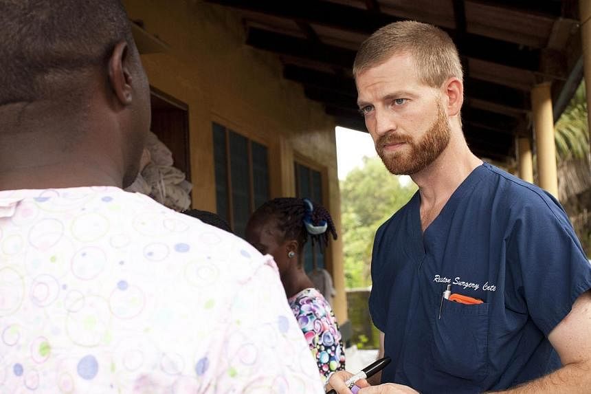 This undated handout photo obtained July 30, 2014 courtesy of Samaritan's Purse shows Dr. Kent Brantly near Monrovia, Liberia.&nbsp;A United States doctor infected with the Ebola virus "seems to be improving," a top US health official said on Sunday,