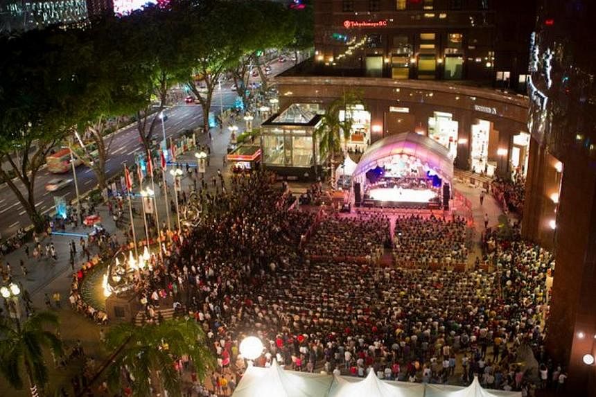 Mr Aaron Tan, who has two sons Kayden and Jayden with getai singer Yuan Jin, took getai to Orchard Road (above) in 2011. -- PHOTO: COURTESY OF AARON TAN