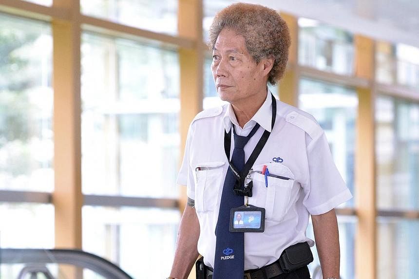 If the new minimum wage is pushed through, security guards can earn about $2,100 each month with overtime, up from just $1,678 now, say industry players. -- PHOTO: ST FILE