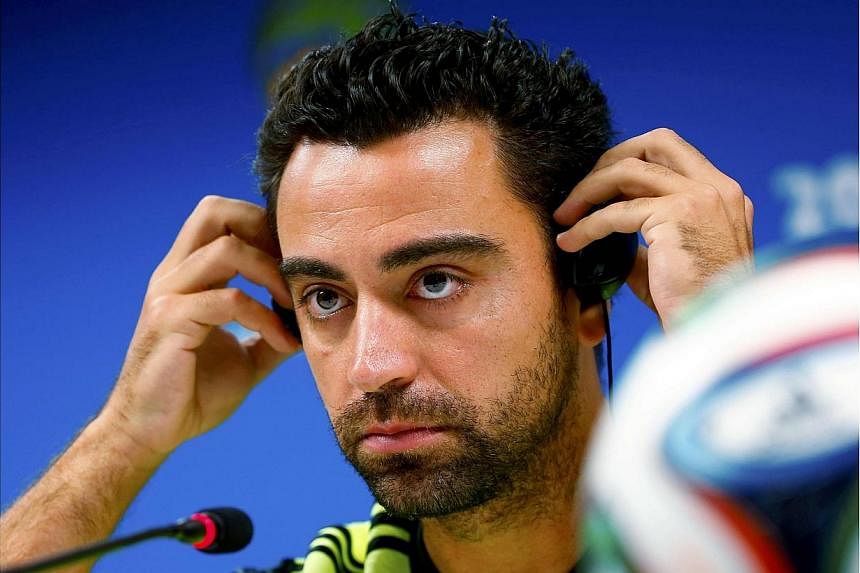 Spain's Xavi Hernandez attends a news conference before his team's practice at the Arena Fonte Nova stadium in Salvador June 12, 2014, a day before their World Cup soccer match against the Netherlands.&nbsp;Spain midfielder Xavi Hernandez announced o