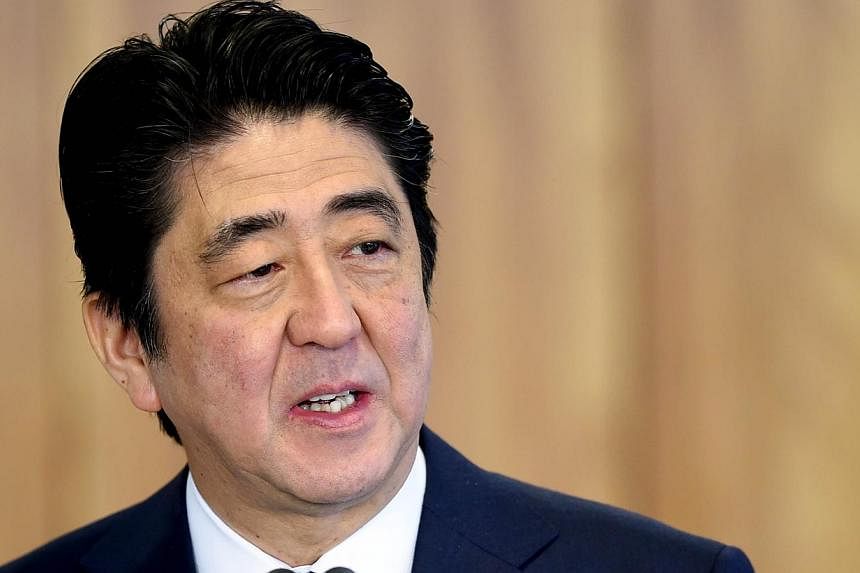 Japanese Prime Minister Shinzo Abe said on Tuesday that he will reshuffle his Cabinet and leadership posts in the Liberal Democratic Party in first week of September. -- PHOTO: AFP