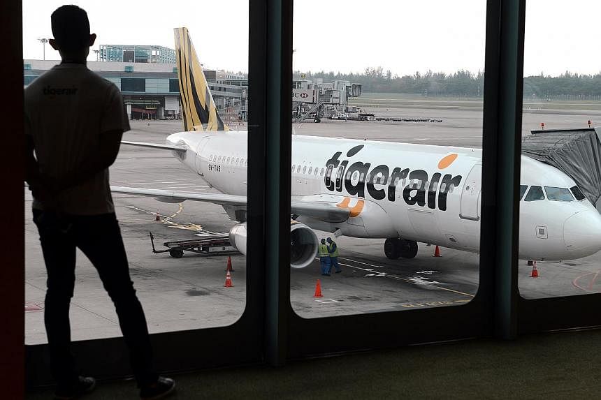 A Tigerair plane at Changi Airport on July 3, 2013. A Tigerair plane was grounded in Trichy after pilots discovered a windshield crack during a flight from Singapore to the south Indian city on Monday. -- PHOTO: ST FILE