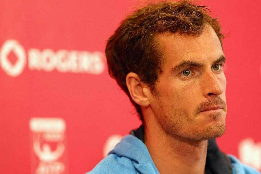 Andy Murray of Great Britain talks with the media during the Rogers Cup at Rexall Centre at York University in Toronto, Canada on Aug 3, 2014. -- PHOTO: AFP&nbsp;