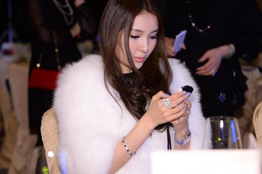 This picture taken on Dec 1, 2013, shows Guo Meimei attending a jewellery auction in Beijing.&nbsp;Guo, who sparked online controversy by flaunting her wealth three years ago, has come under the media spotlight again for her involvement in the sex tr