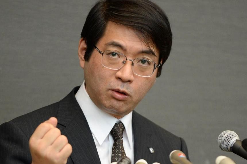 This file photo taken on April 16, 2014 shows Yoshiki Sasai, supervisor of 30-year-old scientist Haruko Obokata of Riken Institute, answering questions during a press conference in Tokyo. The top Japanese stem cell scientist, who co-wrote groundbreak