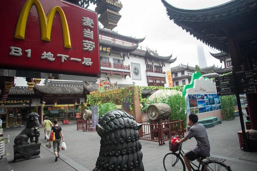 A McDonald's restaurant logo is seen on July 24, 2014 in Shanghai. The company says a recent scandal over expired meat from a Chinese food supplier has had a “significant negative impact” on sales in China, Japan and some other markets.&nbsp; -- 