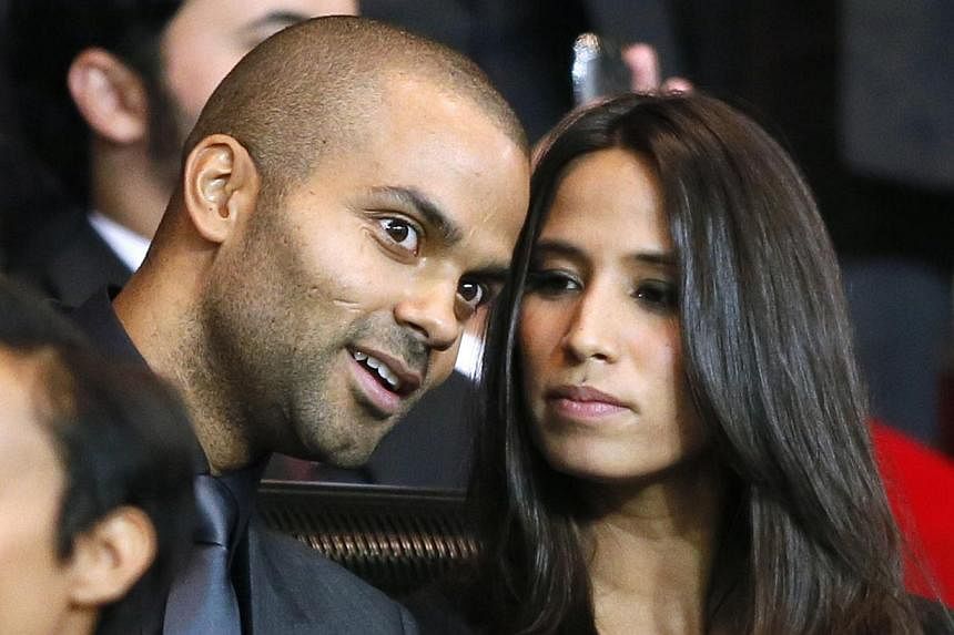 A September 18, 2012 file photo shows French NBA and international basketball player Tony Parker with his girlfriend Axelle Francine during the UEFA Champions League match between Paris Saint-Germain (PSG) and FC Dynamo Kiev, at the Parc des Princes 