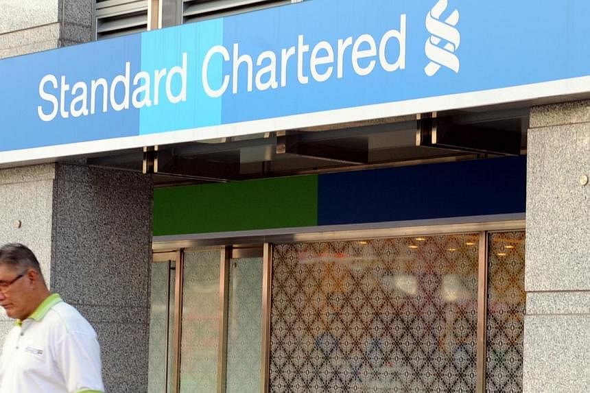 Standard Chartered Bank's performance in the first half of the year was affected by muted global trade sentiment, regulatory changes and weak commodity prices. -- PHOTO: ST FILE