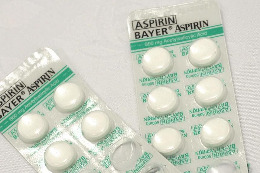 Taking a small daily dose of aspirin can significantly reduce the risk of developing - or dying from - bowel, stomach and oesophageal cancer, according to a large review of scientific studies. -- PHOTO: ST FILE