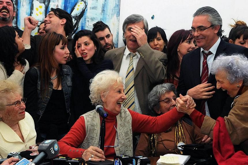 Estela Carlotto (centre), the president of Abuelas de Plaza de Mayo (Grandmothers of Plaza de Mayo), an association that seeks to reunite babies stolen during the military regime (1976-1983) with their biological parents or relatives, celebrates find