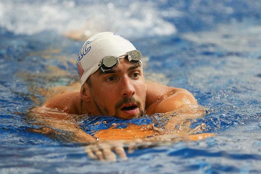 Michael Phelps warms up prior to the Saturday finals of the Bulldog Grand Slam at Gabrielsen Natatorium. -- PHOTO: REUTERS