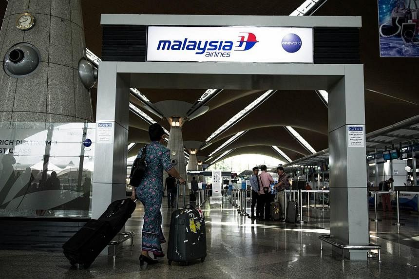The Kuala Lumpur International Airport in Sepang on July 21, 2014. Malaysia has included Ebola screening for those arriving from the Philippines, the United States and Britain. -- PHOTO: AFP