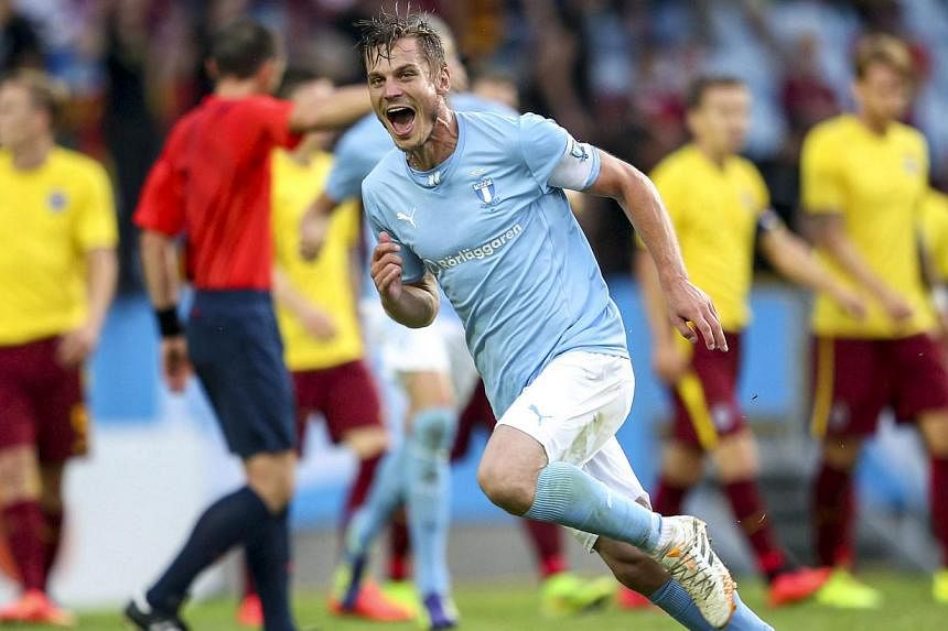 Malmo's Markus Rosenberg celebrates after scoring his second goal during the Champions League match between Malmo and Sparta Prague at Swedbank stadium in Malmo on Aug 6, 2014. -- PHOTO: REUTERS