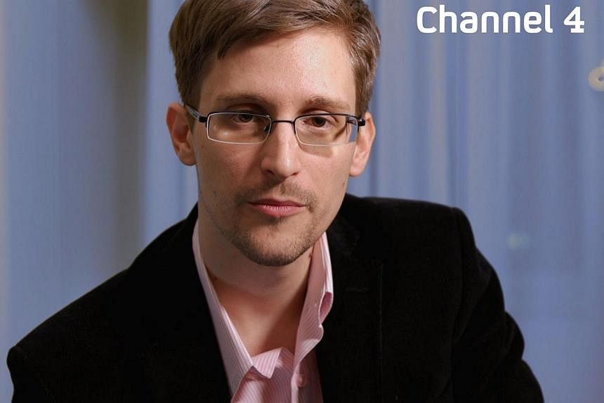 An undated handout photo received from Channel 4 on Dec 24, 2013 shows US intelligence leaker Edward Snowden preparing to make his television Christmas message.&nbsp;Former U.S. intelligence contractor Edward Snowden has received a three-year residen