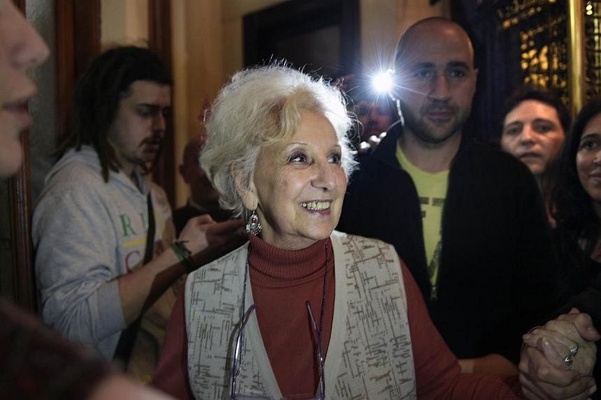 Estela Carlotto (centre) the president of Abuelas de Plaza de Mayo (Grandmothers of Plaza de Mayo), celebrates after announcing the recovery of her grandson Guido, the son of her daughter Laura who went missing in 1976, in Buenos Aires on August 5, 2