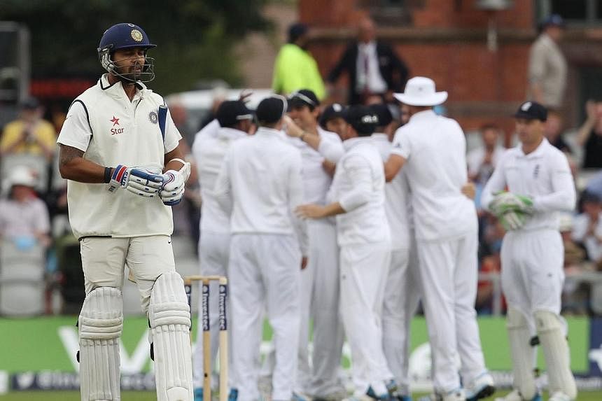 India's Murali Vijay leaves the pitch following his dismissal for no runs during the first day of the fourth cricket Test match between England and India at Old Trafford in Manchester on Thursday, Aug 7, 2014.&nbsp;India's cricketers collapsed specta