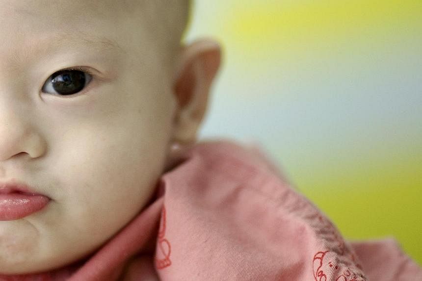 Australian authorities have finally managed to contact the biological father of baby Gammy, who was left in the care of Thai surrogate mother. The man, who has a past conviction as a paedophile, was defended by his son as a "changed man". -- PHOTO: R