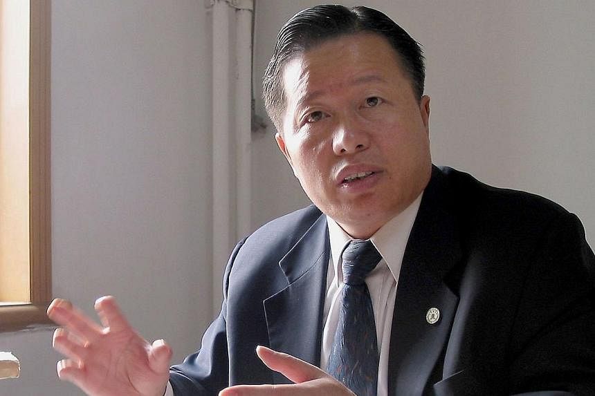 Gao Zhisheng, head of the Beijing-based Zhisheng Legal Office, speaking during an interview at his office in Beijing on Nov 2, 2005. -- PHOTO: AFP
