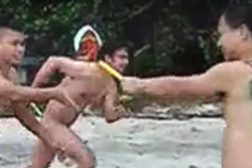 Nudists frolicking on a Penang beach two months ago in a video that went viral and that has now led to an investigation by the police in Malaysia. -- PHOTO: VIMEO