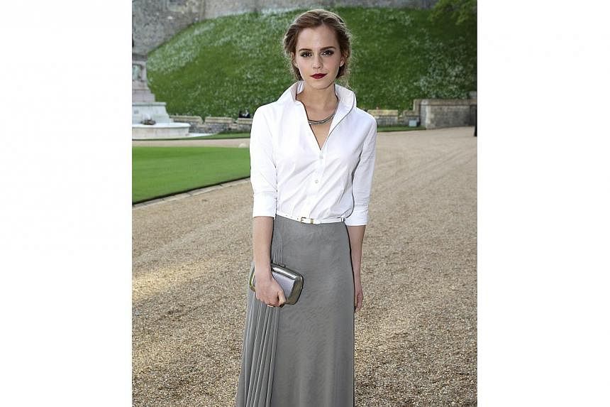 Actress Emma Watson arrives for a dinner hosted by Britain's Prince William at Windsor Castle in southern England on May 13, 2014. She is a first-timer on the Vanity Fair best-dressed list. -- PHOTO: REUTERS