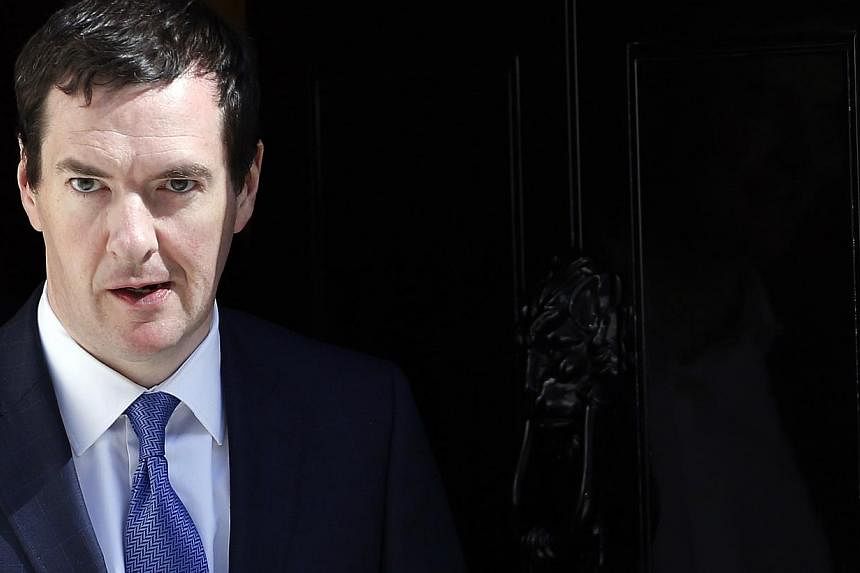 Britain's Chancellor of the Exchequer George Osborne leaving 10 Downing Street in central London on July 16, 2014. He said the&nbsp;regulation of virtual and digital currencies, and the risks associated with them, would be examined in a bid to boost 