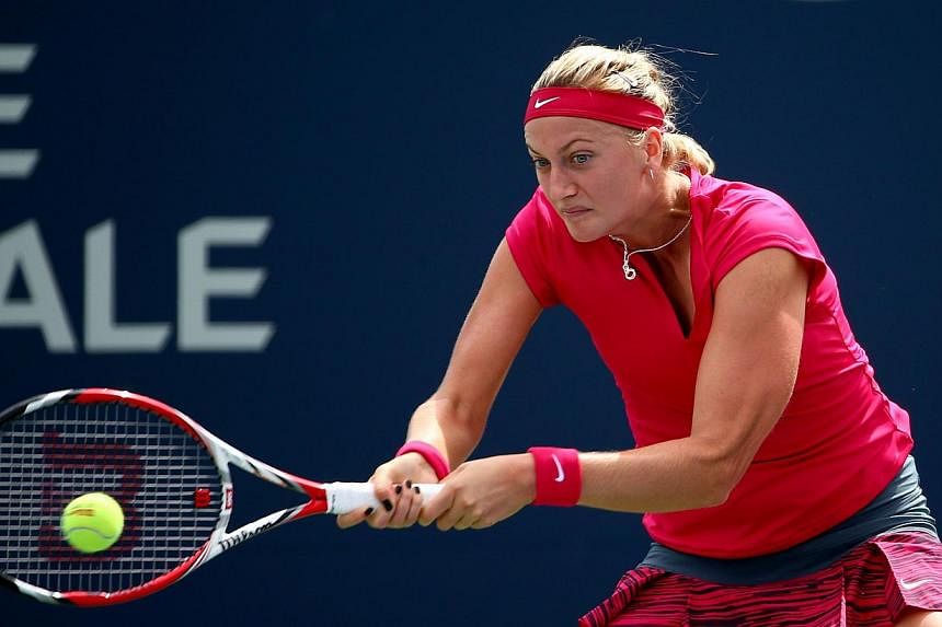 Petra Kvitova of the Czech Republic returns a shot to Ekaterina Makarova of Russia during the Rogers Cup at Uniprix Stadium in Montreal, Canada,&nbsp;on Aug 7, 2014. -- PHOTO: AFP