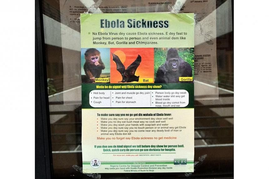 A poster reading "Ebola Sickness" is displayed at the main entrance of Nigerian Health Minister's office in Abuja on Aug 6, 2014. Asian nations are using thermal imaging cameras and posting doctors at airports to screen out sick travellers as health 