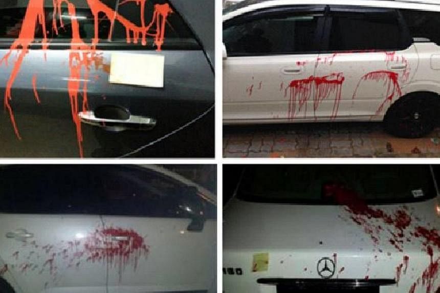 The police said on Friday that they received reports between July 21 and July 30 of vehicles parked at carparks in the two estates that had been splashed with red paint, and discovered debtors notes.&nbsp;-- PHOTO: SINGAPORE POLICE FORCE