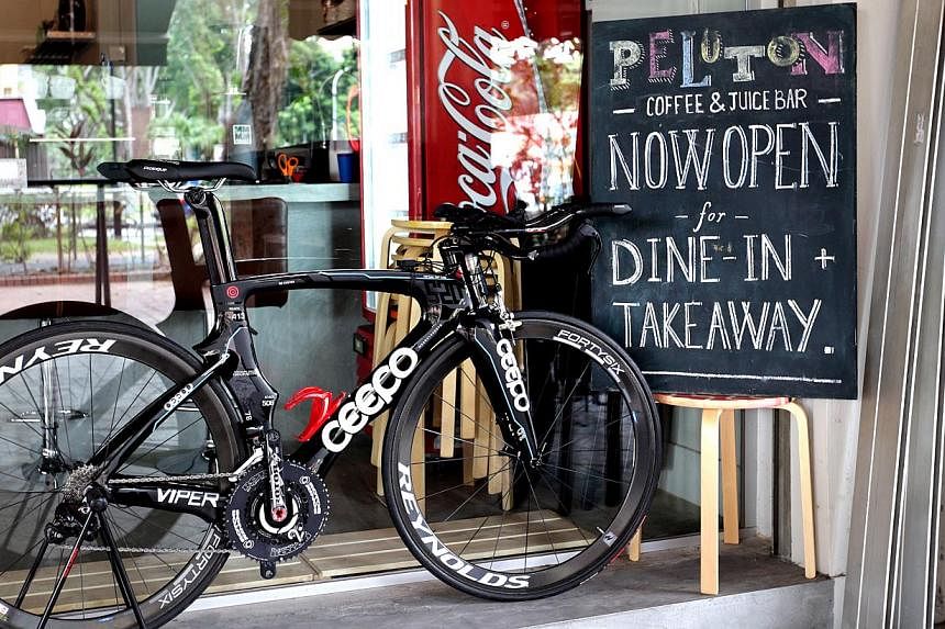 At Peloton Coffee &amp; Juice Bar, triathletes can stop for a bite and buy gear and merchandise. -- ST PHOTO: CHEW SENG KIM
