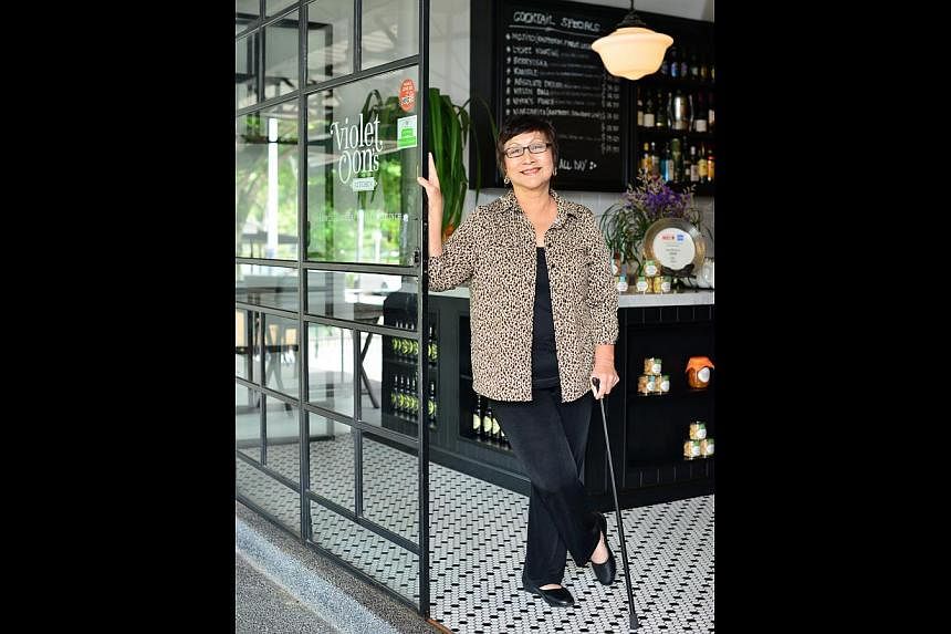 After suffering a stroke, Ms Violet Oon uses a walking stick in case she loses her balance. -- PHOTO: DIOS VINCOY JR FOR THE STRAITS TIMES