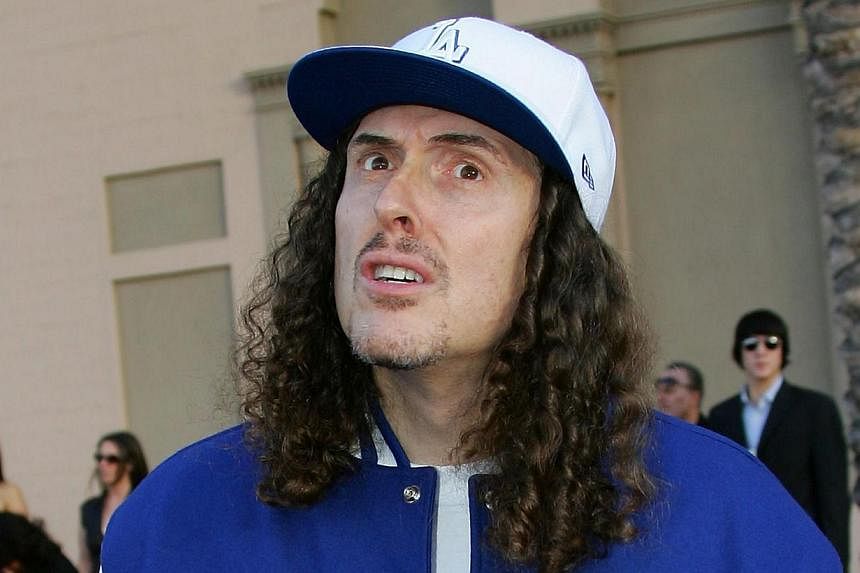 This November 21, 2006 file photo shows US pop satirist Weird Al Yankovic as he arrives for the American Music Awards in Los Angeles, California. An online petition to get chart-topping parody singer 'Weird Al' Yankovic to headline the highly coveted
