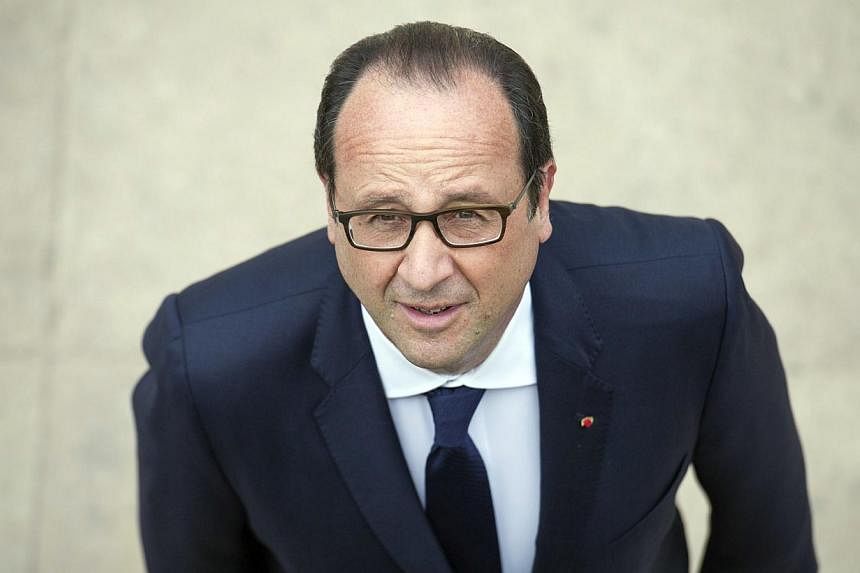 French President Francois Hollande at a World War I commemoration ceremony in northeastern France on August 3, 2014. On Thursday, he pledged his country's "support" to forces battling Islamist militants in Iraq. -- PHOTO: AFP