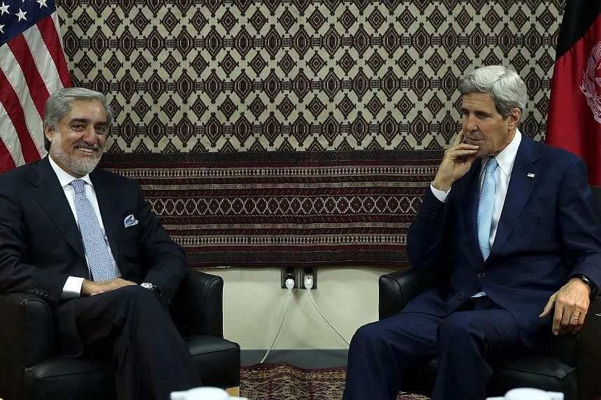 US Secretary of State John Kerry (right) meeting Afghan presidential candidate Abdullah Abdullah at the US embassy in Kabul on August 7, 2014. Mr Kerry arrived in Kabul to pressure feuding presidential candidates to resolve the disputed election resu
