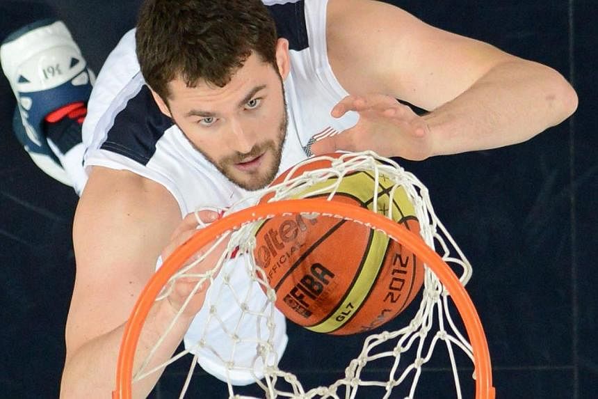 An August 12, 2012 file photo shows US forward Kevin Love as he reaches for the ball during the London 2012 Olympic Games men's gold medal basketball game between USA and Spain at the North Greenwich Arena in London. The Cleveland Cavaliers has reach