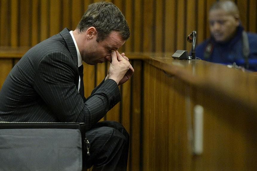 South African Olympic and Paralympic sprinter Oscar Pistorius sits in the dock during the closing defence arguments in the North Gauteng High Court in Pretoria on Aug 8, 2014.&nbsp;A verdict in Pistorius' high profile murder trial has been set for Se