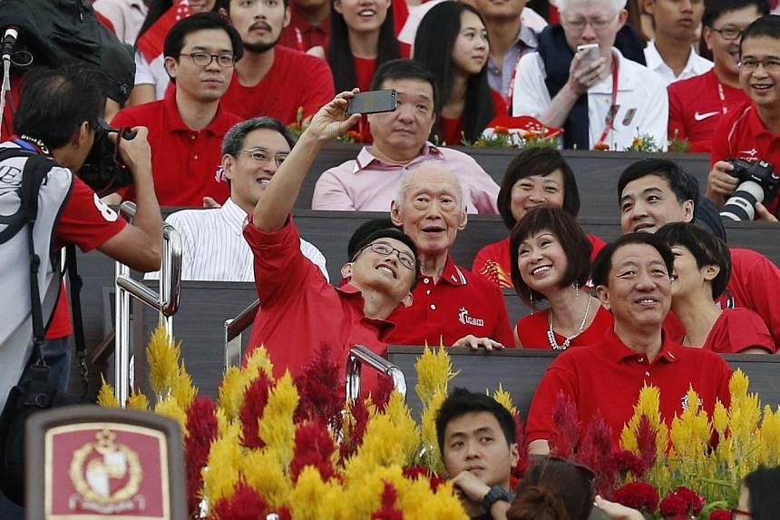 (From left) Minister of State for Trade and Industry Teo Ser Luck snaps a selfie with former prime minister Lee Kuan Yew as MP Lee Bee Wah, Senior Minister of State for Health Amy Khor, Senior Minister of State in the Prime Minister’s Office Heng C