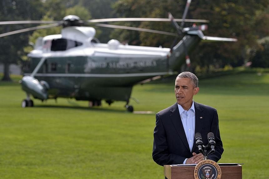 US President Barack Obama delivers a statement before boarding Marine One on the South Lawn of the White House on Aug 9, 2014 in Washington, DC.&nbsp;US airstrikes have destroyed the arms and equipment of militants in Iraq, Mr Obama said Saturday, in