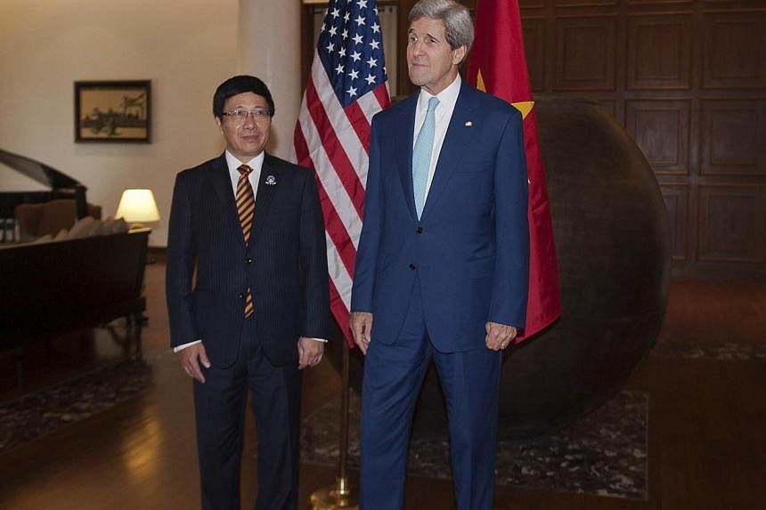 US Secretary of State John Kerry (right) meets with Vietnam's Foreign Minister Pham Binh Minh at the Lake Garden hotel outside the venue of the 47th Asean Foreign Ministers' Meeting in Naypyidaw on Aug 9, 2014.&nbsp;Mr Kerry kicked off a South-east A