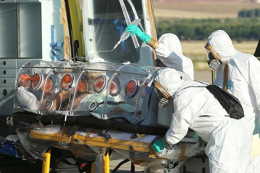 A handout picture taken and released on August 7, 2014 by the Spanish Defense Ministry shows Roman Catholic priest Miguel Pajares, who contracted the deadly Ebola virus, being transported from Madrid's Torrejon air base to the Carlos III hospital upo