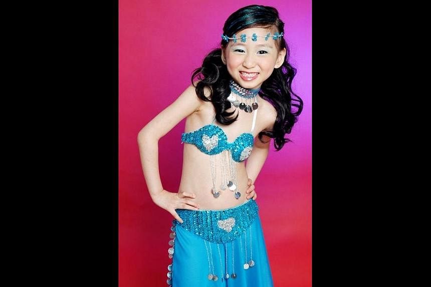 Evette Tan (above) when she was eight years old, a year after she started learning belly dancing from her entrepreneur mother.