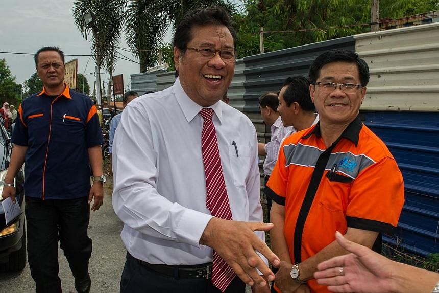 Chief Minister of Selangor Abdul Khalid Ibrahim (centre) attending a ceremony to launch the third bridge project in Klang, outside Kuala Lumpur on August 6, 2014. A power-broking rift within Malaysia's opposition alliance is spurring fears that the u