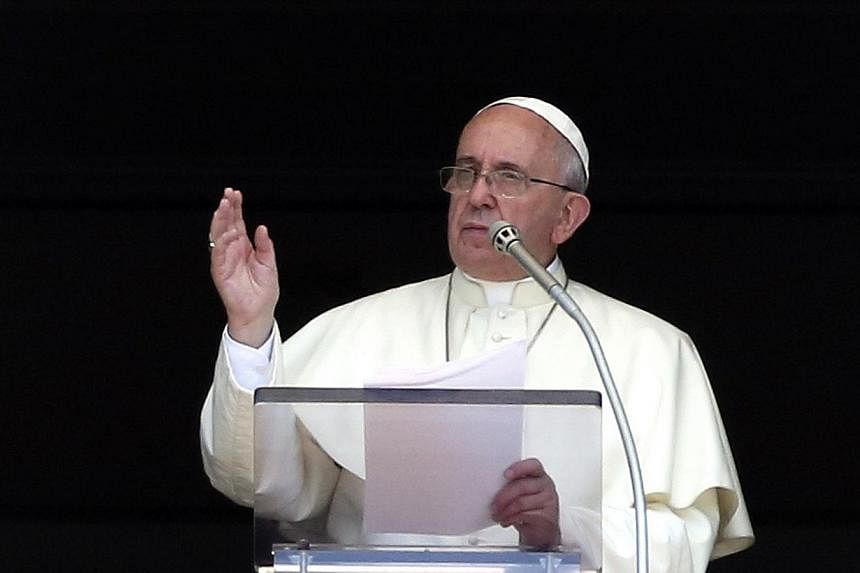 Pope Francis speaks as he leads the Angelus prayer in Saint Peter's Square at the Vatican on Aug 10, 2014.&nbsp;Pope Francis said that violence and destruction in Iraq offends God and humanity and he held a silent prayer for victims of the conflict d