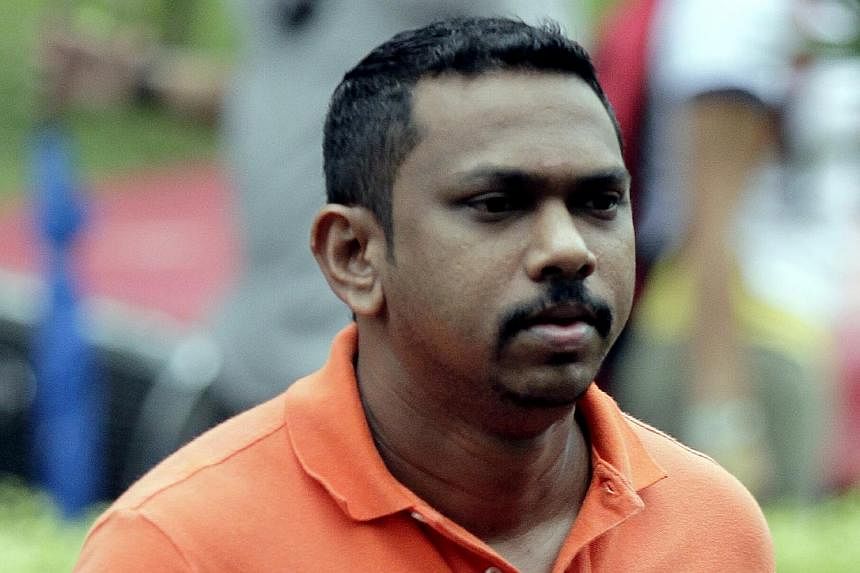 Malaysian Thanasegar S. Sinnaiah who jumped bail two years ago, was re-arrested and brought before a Special Sitting of Criminal Mentions at the State Courts on Sunday morning. -- PHOTO: ST FILE