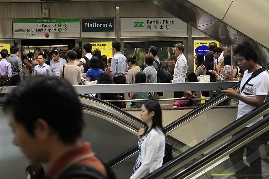 Raffles Place MRT is one of three stations where commuters will get to enjoy free Wi-Fi access at platform level from August 22. -- PHOTO: ST FILE